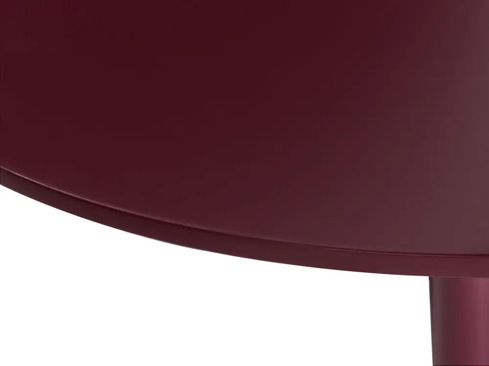 Close-up of a maroon chair with a white background