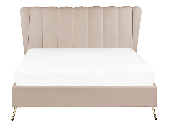 Beige upholstered bed with a white mattress on a white background