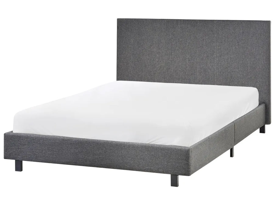 Gray upholstered bed with white mattress on a white background