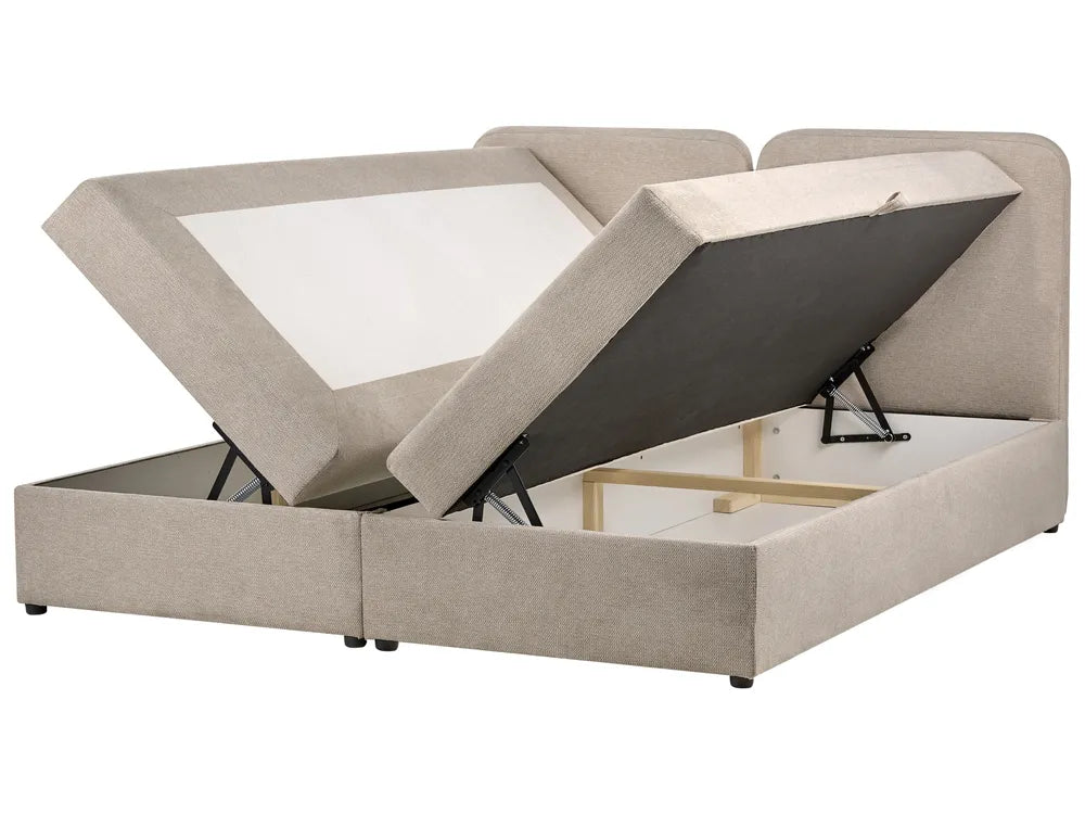 Beige upholstered bed with storage compartments on a white background