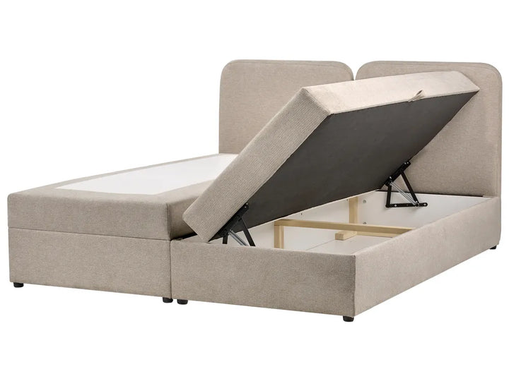 Beige bed with storage compartment on a white background