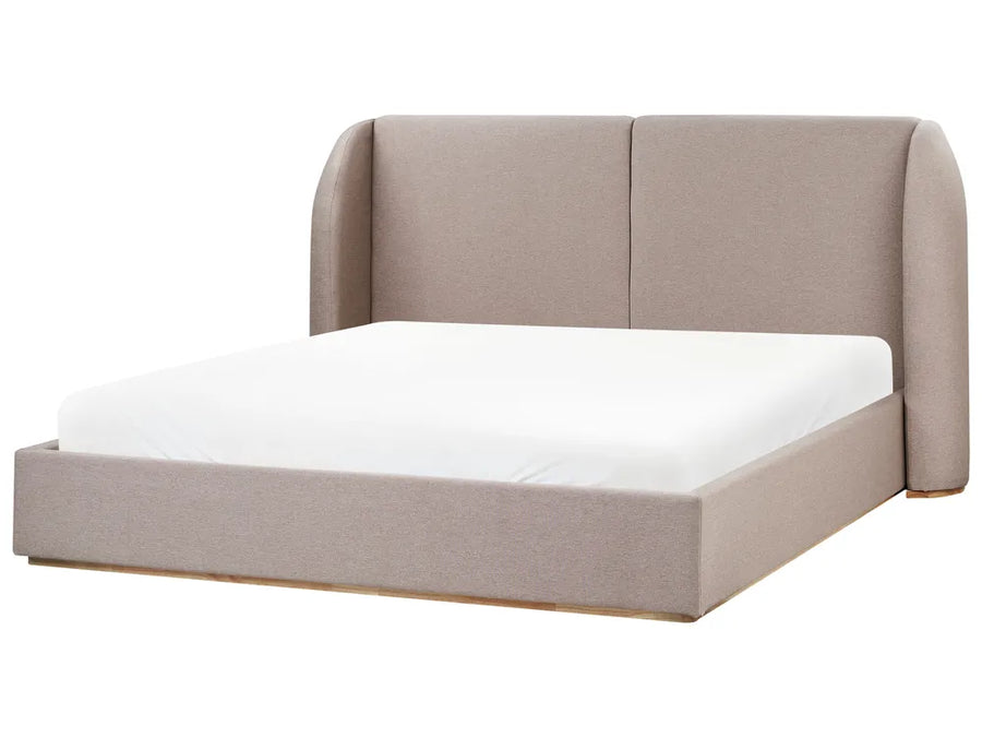 Beige upholstered bed with white mattress on a white background