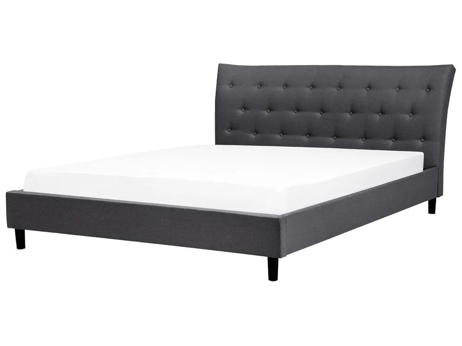 Gray upholstered bed with white mattress on a white background