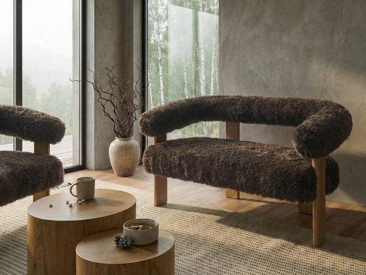 Modern interior with brown textured chairs and a wooden coffee table.