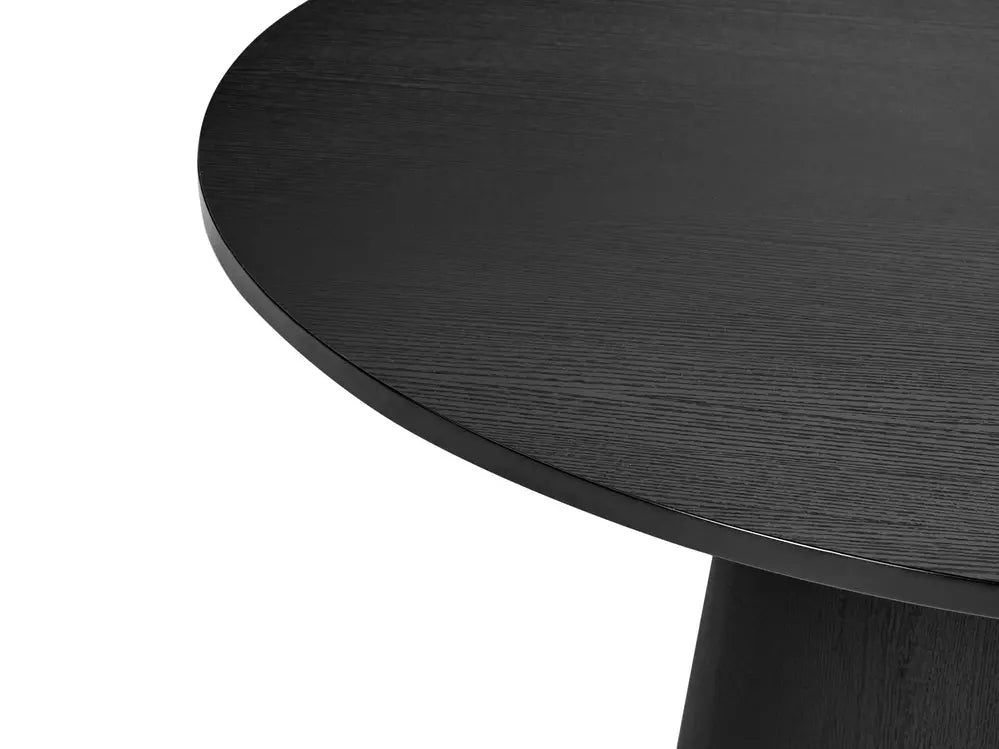 Close-up of a black round table with a white background