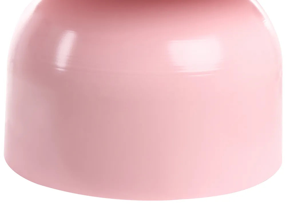 Close-up of a pink plastic component on a white background