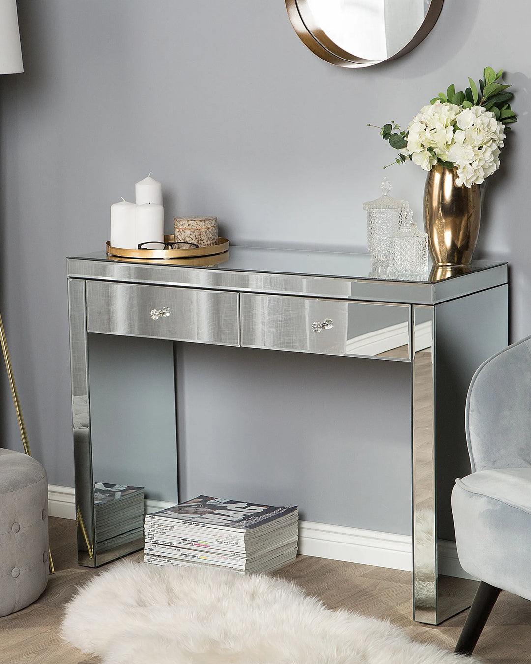 Decorative console table with mirror finish in a room setting.