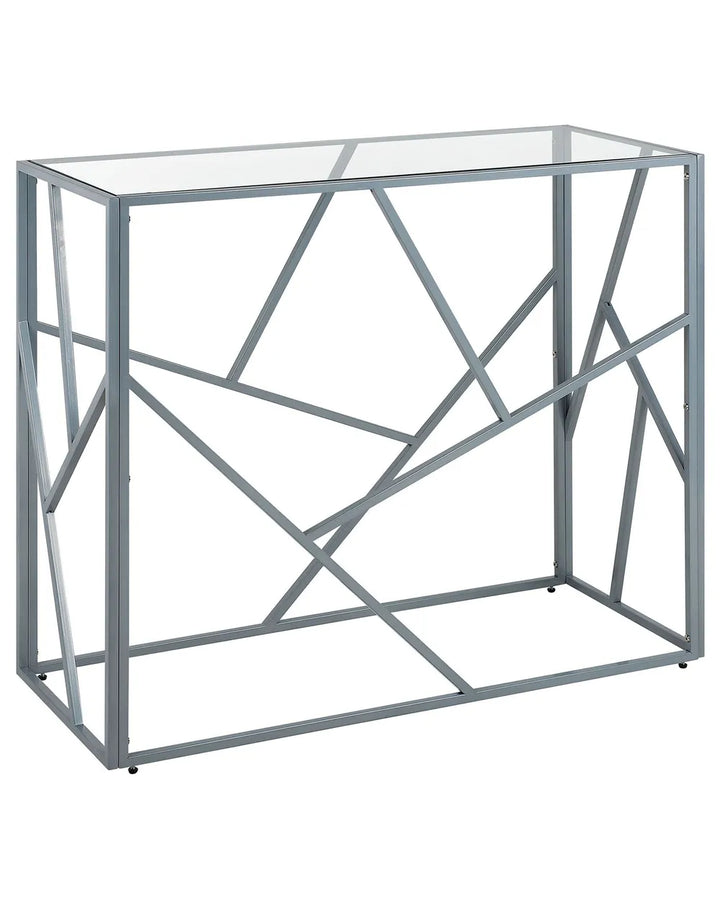 Modern console table with geometric metal frame and glass top on a white background