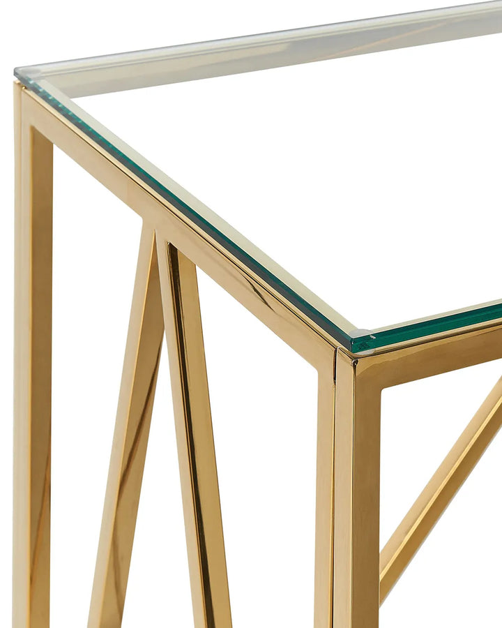 Gold-framed glass table corner on a white background
