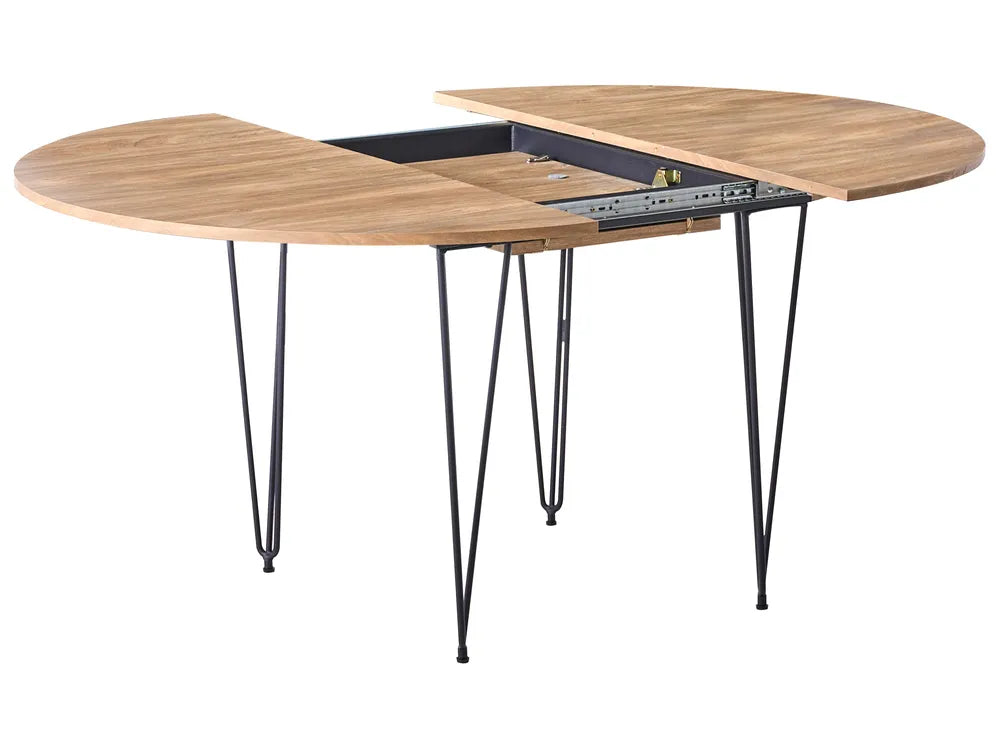 Wooden dining table with hairpin legs on a white background