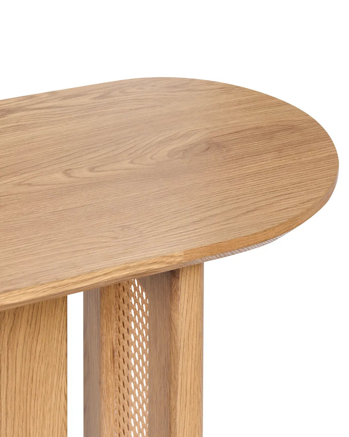 Wooden side table with mesh base on a white background