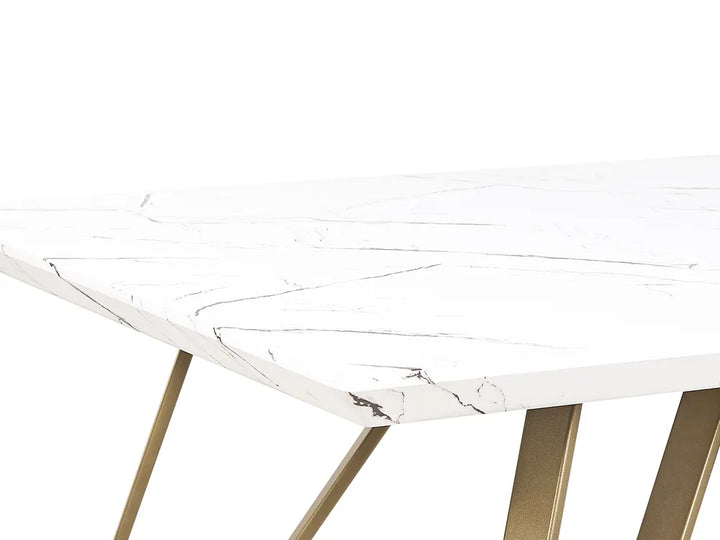 Round marble table with gold legs on a white background