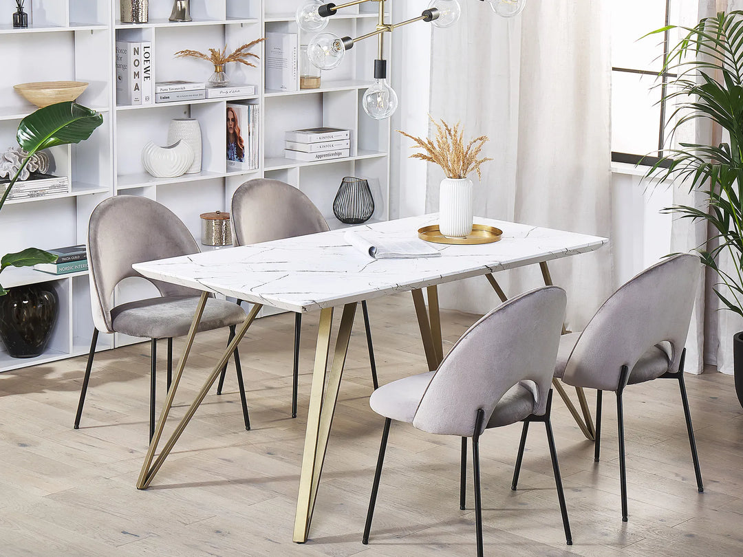Dining room with marble table and gray chairs in a modern interior setting.