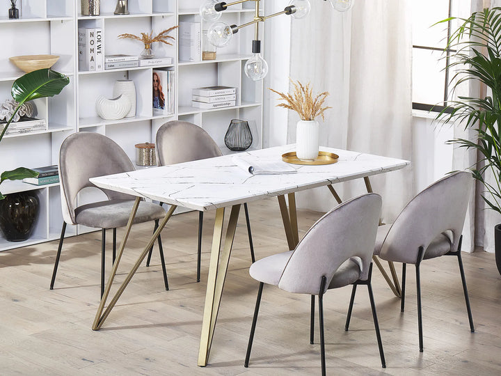 Dining room with marble table and gray chairs in a modern interior setting.