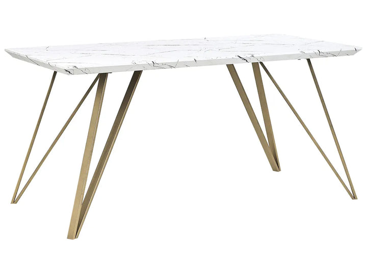 Dining table with white marble top and gold metal legs on a white background