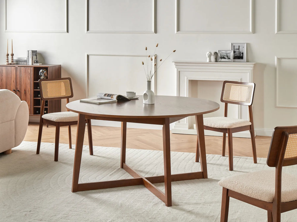 Dining room with wooden table and chairs in a well-lit room.